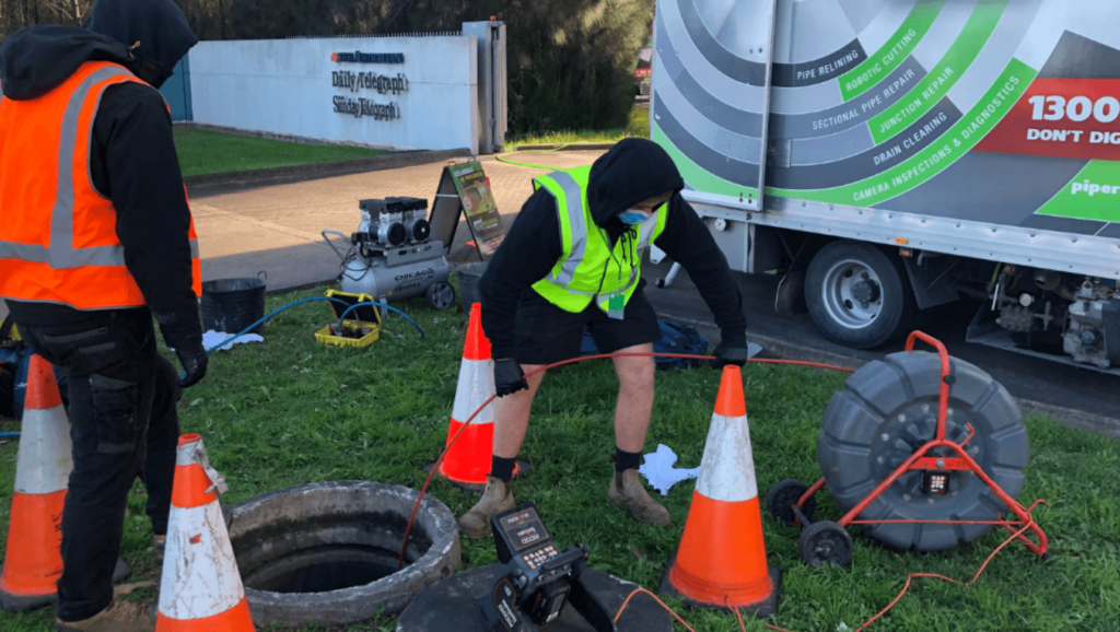 pipe relining solutions technician operating cctv camera at daily telegraph