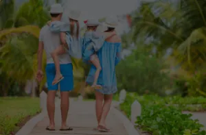 family walking in tropical landscape