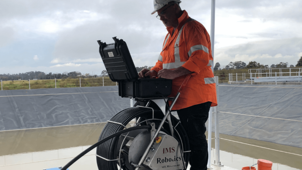 pipe relining solutions technician operating robotic cutter at shoalhaven water works