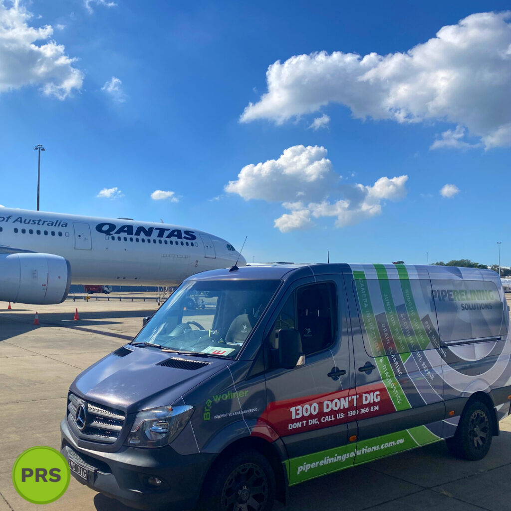 pipe relining solutions car alongside airplane
