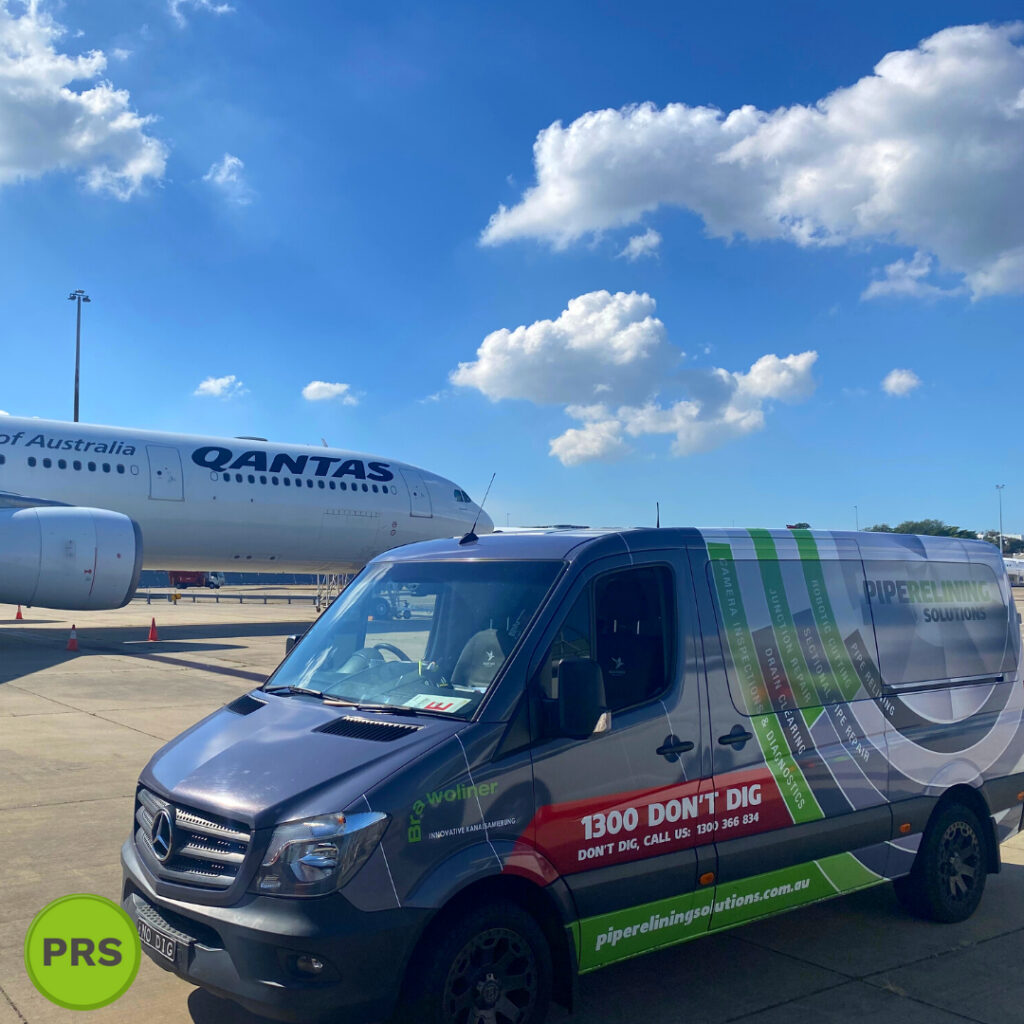 pipe relining solutions car alongside airplane